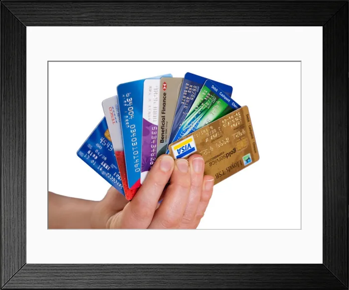 Framed Print : woman holding credit cards Framed Print : woman holding credit cards