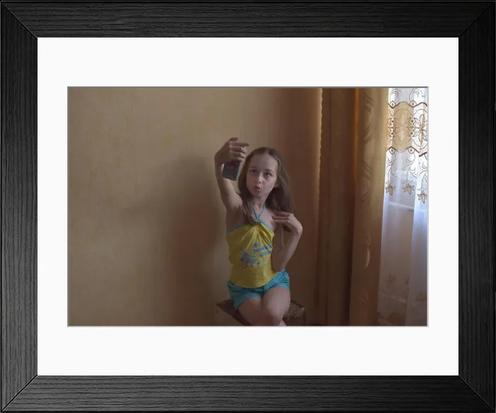 Framed Print : Selfie star. Small girl take selfie with smartphone Framed Print : Selfie star. Small girl take selfie with smartphone