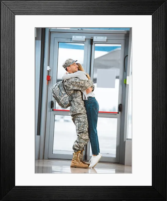 Framed Print : happy girlfriend hugging cheerful boyfriend in military uniform in airport Framed Print : happy girlfriend hugging cheerful boyfriend in military uniform in airport