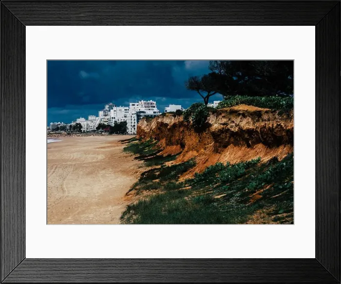 Framed Print : Quarteira Beach in Quarteira, Algarve, Portugal on a cloudy day - erosion next to beach Framed Print : Quarteira Beach in Quarteira, Algarve, Portugal on a cloudy day - erosion next to beach