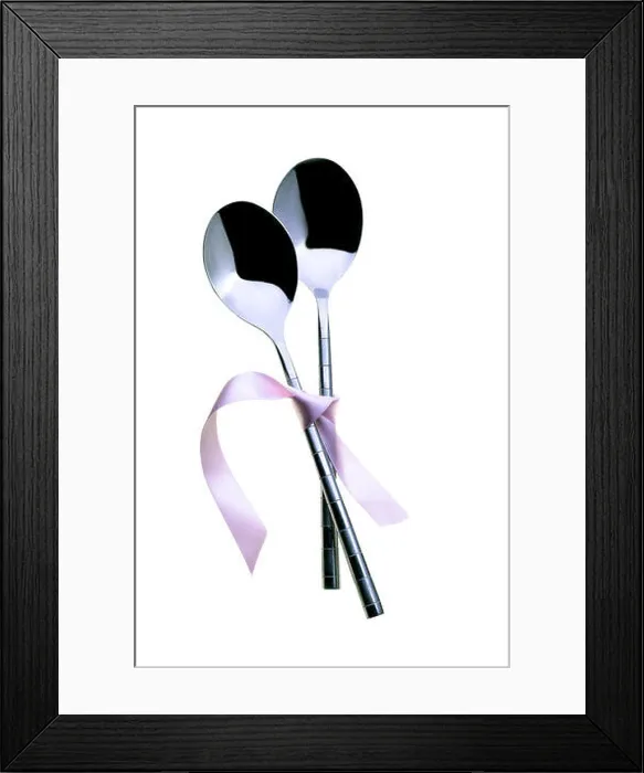 Framed Print : Two spoons tied together with pink ribbon. On a white background Framed Print : Two spoons tied together with pink ribbon. On a white background