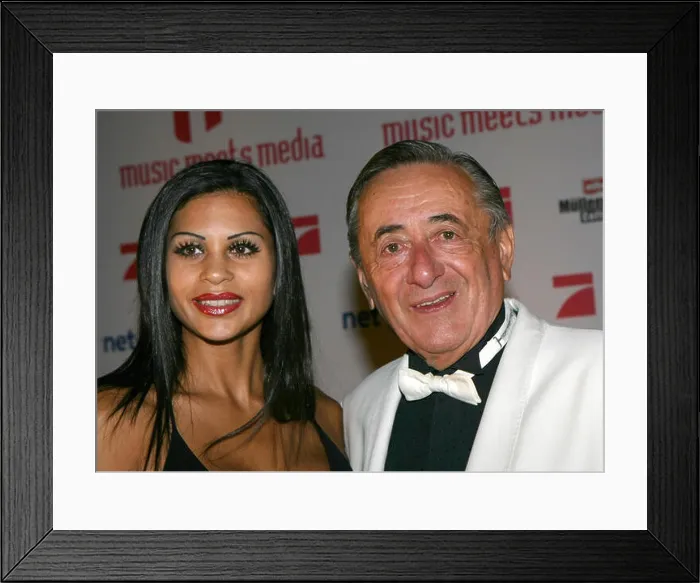 Framed Print : Building contractor Richard Lugner and his escort Nina ?Bambi? Bruckner arrive at the ?Music meets Media Framed Print : Building contractor Richard Lugner and his escort Nina ?Bambi? Bruckner arrive at the ?Music meets Media