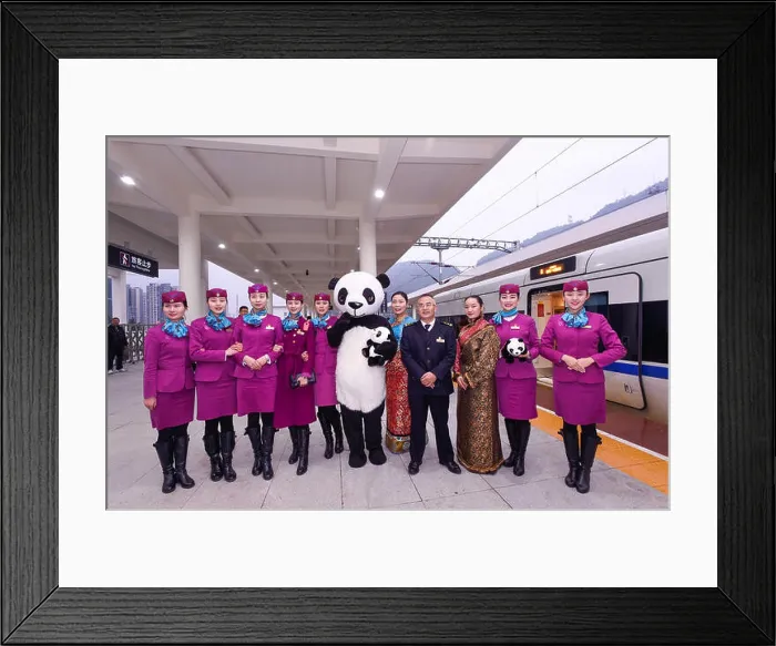 Framed Print : Chinese train attendants pose with a worker dressed in giant panda costumes in front of a CRH (China Railway High-speed) Framed Print : Chinese train attendants pose with a worker dressed in giant panda costumes in front of a CRH (China Railway High-speed)