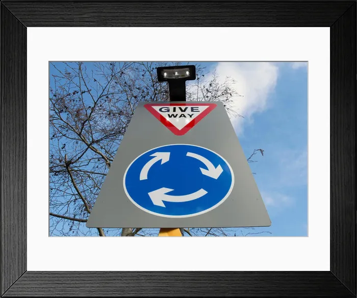 Framed Print : british road sign indicating a roundabout ahead and instructing road users to give way on reaching it Framed Print : british road sign indicating a roundabout ahead and instructing road users to give way on reaching it