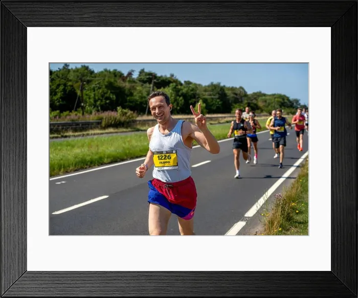 Framed Print : Filippo Fontanelli, runner no. 1226, waves to the camera while competing in the 2025 Scottish Half Marathon in Scotland Framed Print : Filippo Fontanelli, runner no. 1226, waves to the camera while competing in the 2025 Scottish Half Marathon in Scotland