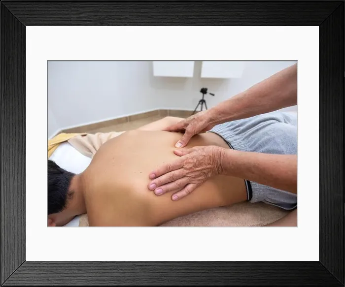 Framed Print : Boy have a massage from old person Framed Print : Boy have a massage from old person