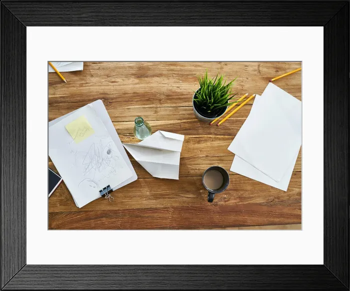 Framed Print : Papers on wooden table in office Framed Print : Papers on wooden table in office