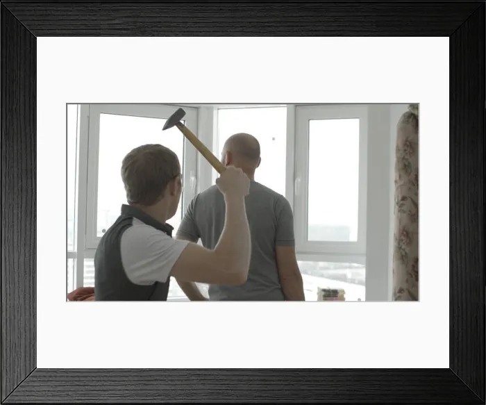 Framed Print : Man sneaks up behind to hit with a hammer. Swings a hammer to hit Framed Print : Man sneaks up behind to hit with a hammer. Swings a hammer to hit
