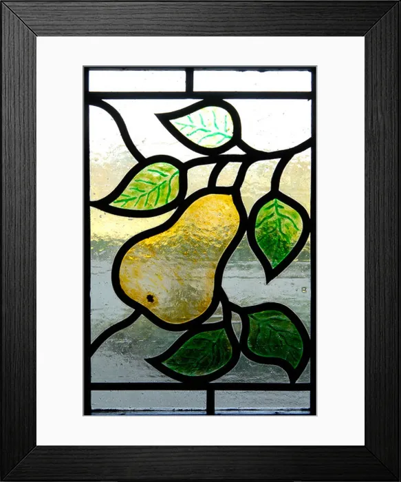 Framed Print : A stained-glass window, part of a door, with a pear motif Framed Print : A stained-glass window, part of a door, with a pear motif