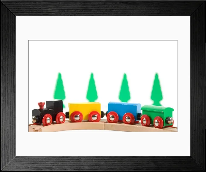 Framed Print : Wooden toy train on isolated white background Framed Print : Wooden toy train on isolated white background