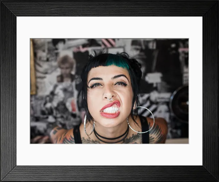 Framed Print : A portrait of a young woman making a face Framed Print : A portrait of a young woman making a face
