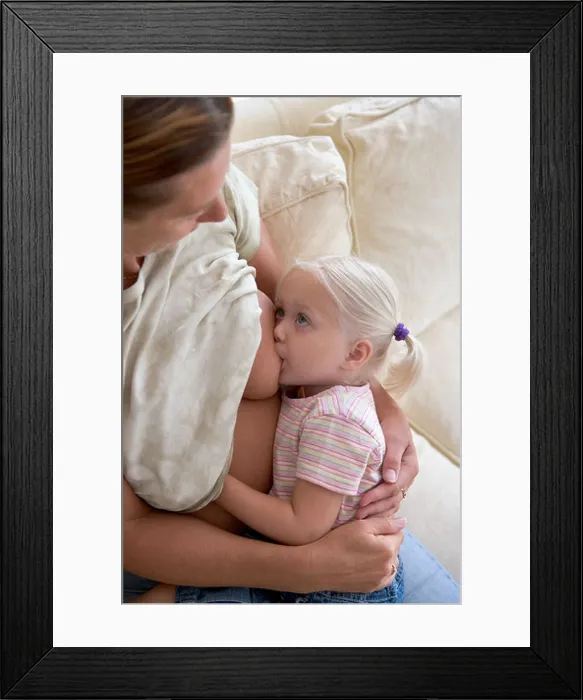 Framed Print : Breastfeeding a 3 year old girl Framed Print : Breastfeeding a 3 year old girl