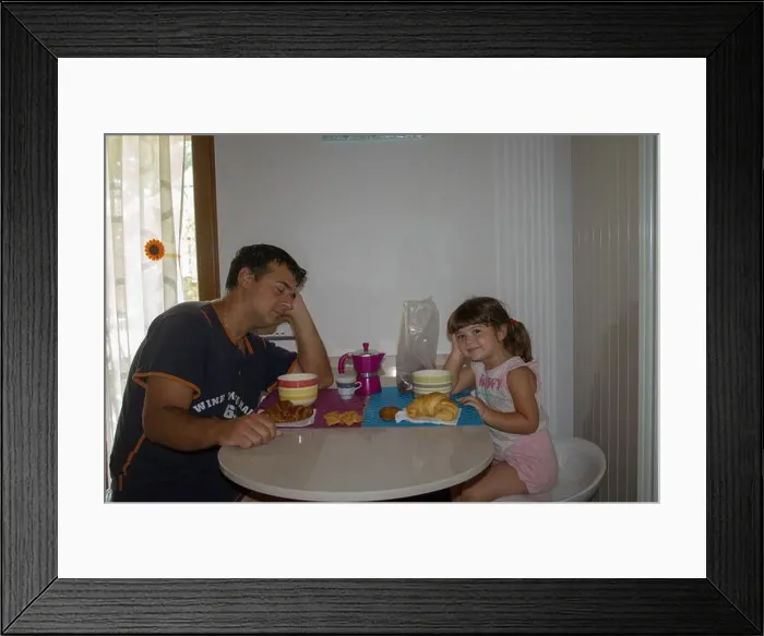 Framed Print : Picture of a sleepy and just waking up dad with his daughter while having breakfast in the morning Framed Print : Picture of a sleepy and just waking up dad with his daughter while having breakfast in the morning