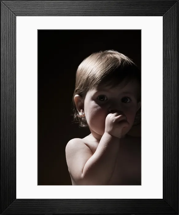 Framed Print : Baby girl sucking her thumb Framed Print : Baby girl sucking her thumb