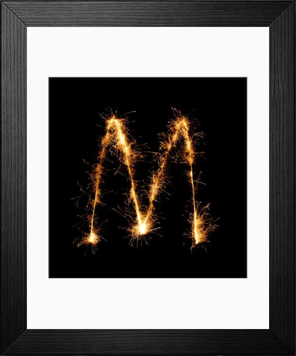 Framed Print : Sparkler firework light alphabet M (Capital Letters) at night background Framed Print : Sparkler firework light alphabet M (Capital Letters) at night background