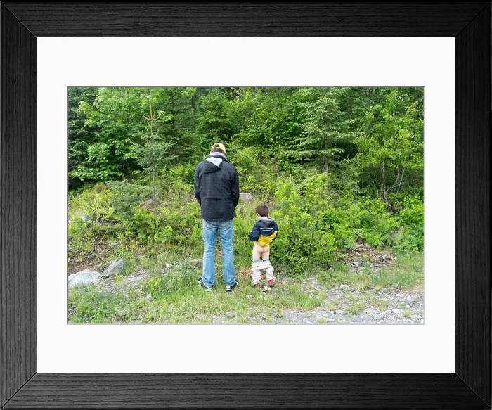 Framed Print : father and son peing in the woods Framed Print : father and son peing in the woods