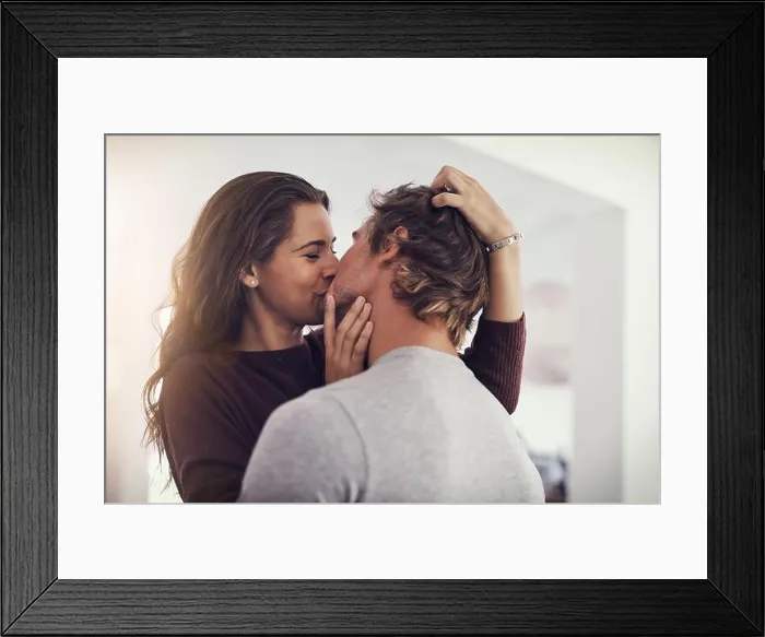 Framed Print : Your kisses make me melt. Shot of a young couple making out in the kitchen Framed Print : Your kisses make me melt. Shot of a young couple making out in the kitchen