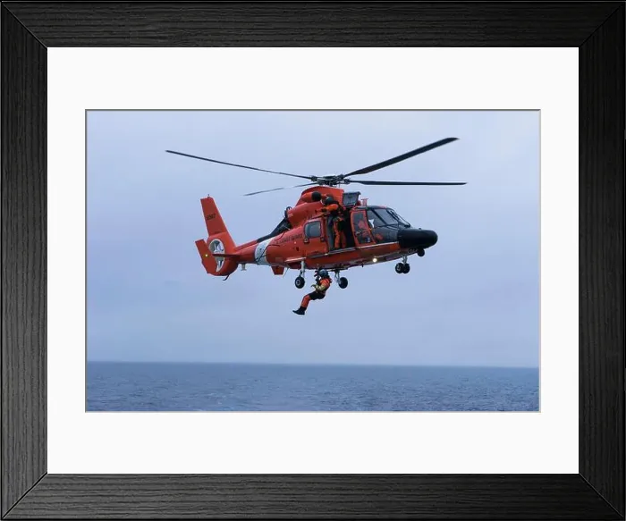 Framed Print : AST3 Roberto Ochoa is hoisted down from USGC MH-6567 helicopter Framed Print : AST3 Roberto Ochoa is hoisted down from USGC MH-6567 helicopter