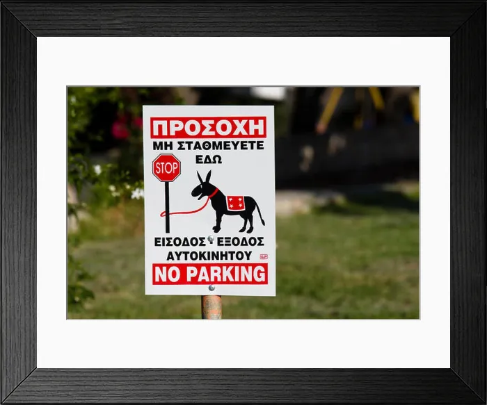 Framed Print : Sign for no parking in greek, in graphic shows a donkey tied to a pole Stop Framed Print : Sign for no parking in greek, in graphic shows a donkey tied to a pole Stop