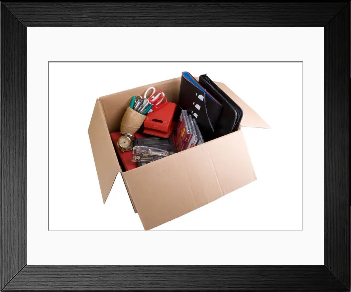 Framed Print : Desk contents in a cardboard box Framed Print : Desk contents in a cardboard box