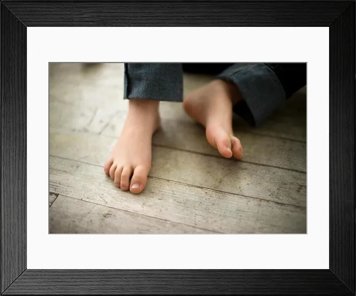 Framed Print : Portrait of young boy's feet Framed Print : Portrait of young boy's feet