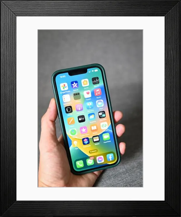 Framed Print : iPhone with iOS 16 logo on home screen Framed Print : iPhone with iOS 16 logo on home screen