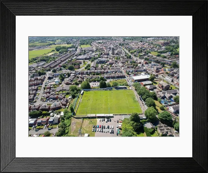 Framed Print : Aerial drone top view of football soccer field with people playing Framed Print : Aerial drone top view of football soccer field with people playing
