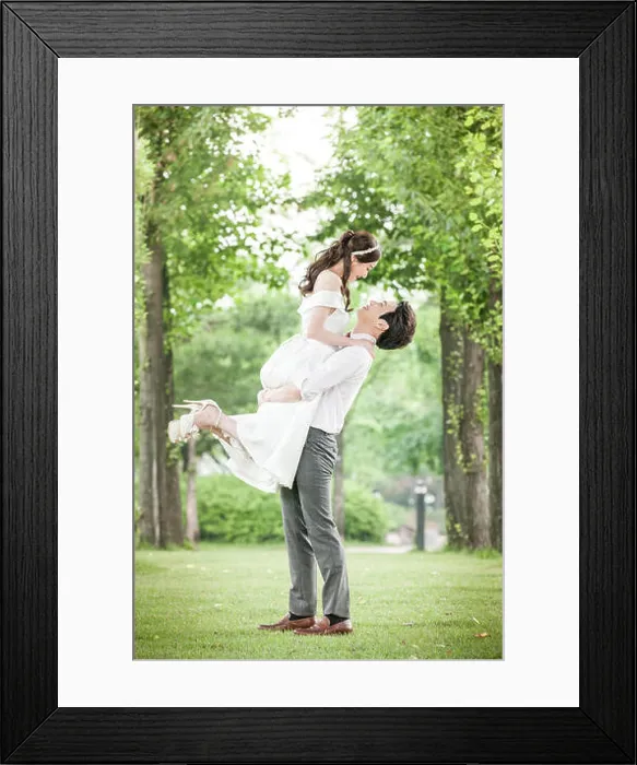 Framed Print : Side view of young romantic wedding couple holding face to face outdoors Framed Print : Side view of young romantic wedding couple holding face to face outdoors