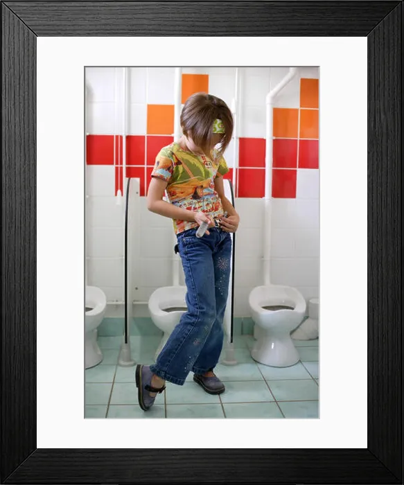 Framed Print : Young girl in the toilets at preschool Framed Print : Young girl in the toilets at preschool