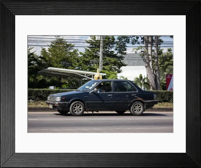 Framed Print : Chiangmai, Thailand - November 21 2019: Private old car Nissan Sunny Framed Print : Chiangmai, Thailand - November 21 2019: Private old car Nissan Sunny