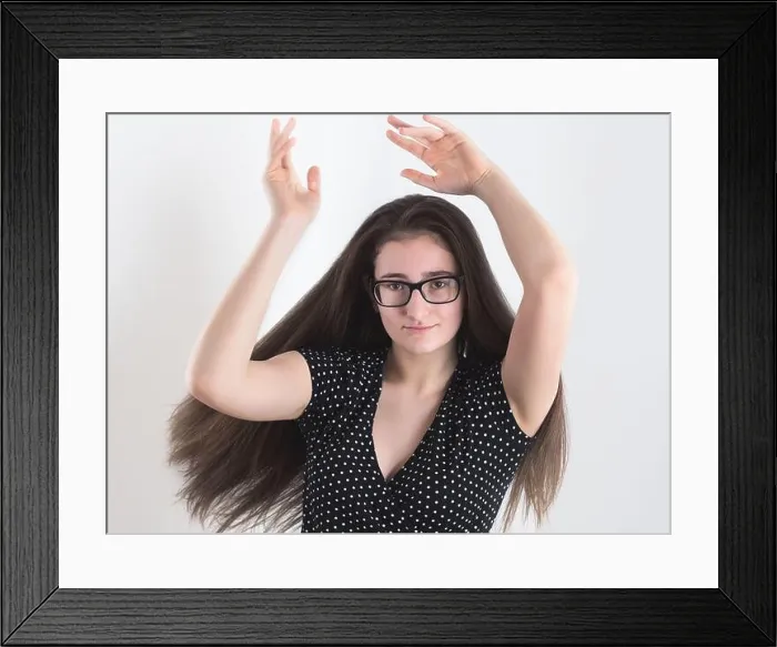 Framed Print : Portrait of a Dancing Bespectacled Long-haired Brunette Teen Girl with Hands in the Air Framed Print : Portrait of a Dancing Bespectacled Long-haired Brunette Teen Girl with Hands in the Air