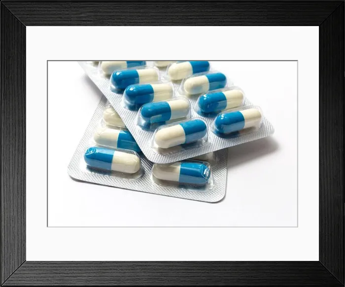Framed Print : Blue and white capsules close up Framed Print : Blue and white capsules close up