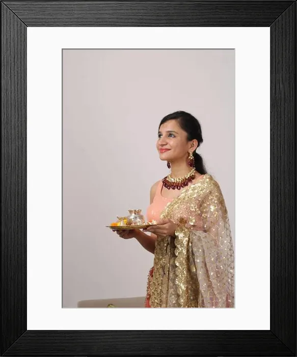 Framed Print : Beautiful Indian girl holding pooja thali Framed Print : Beautiful Indian girl holding pooja thali