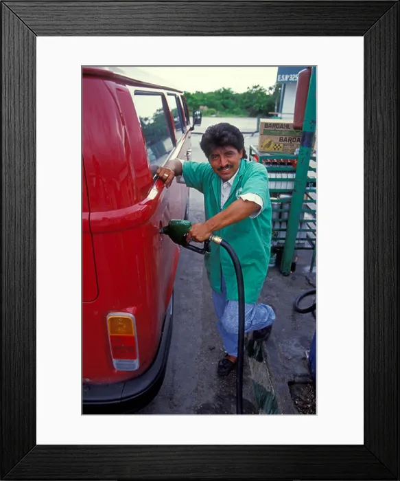 Framed Print : 1 one Mexican man, pumping gas Framed Print : 1 one Mexican man, pumping gas