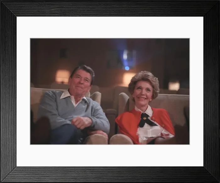 Framed Print : English: President Reagan and Nancy Reagan watching a film in the White House Theater Framed Print : English: President Reagan and Nancy Reagan watching a film in the White House Theater