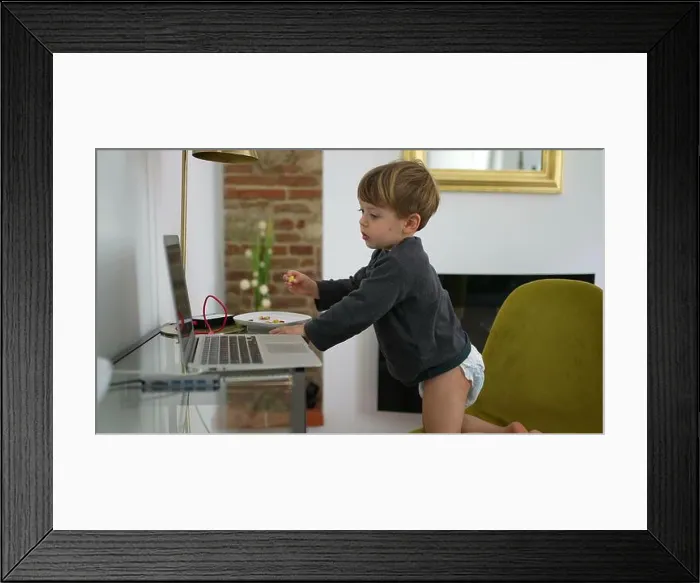 Framed Print : Baby boy wearing diapers in front of laptop at home 2 year old toddler Framed Print : Baby boy wearing diapers in front of laptop at home 2 year old toddler