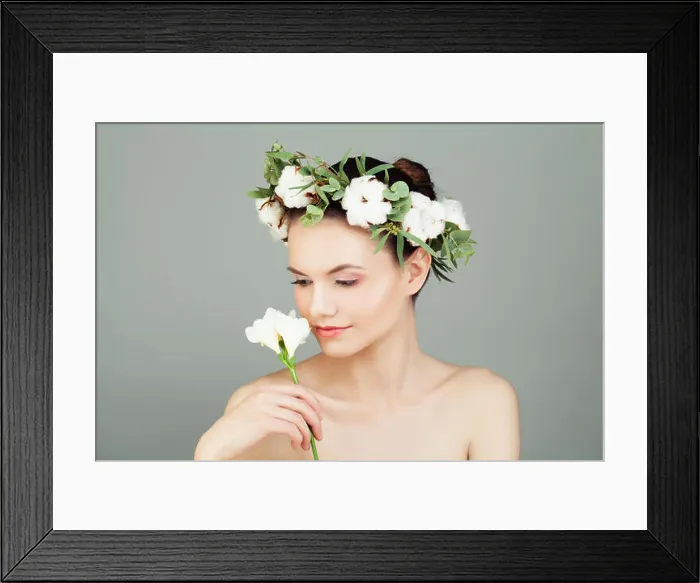 Framed Print : Spa Model Woman Holding White Flower in her Hand. Cute Female Face, Healthy Skin and White Cotton Flowers Framed Print : Spa Model Woman Holding White Flower in her Hand. Cute Female Face, Healthy Skin and White Cotton Flowers