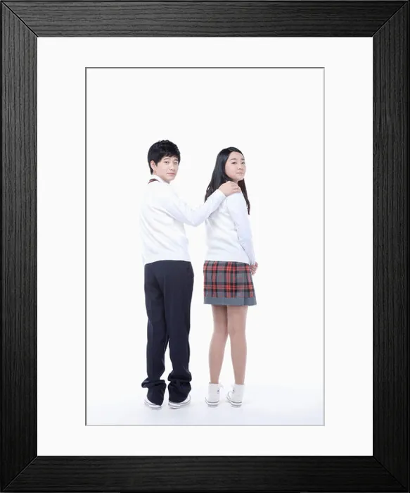 Framed Print : boy putting his arm around girl's shoulder Framed Print : boy putting his arm around girl's shoulder