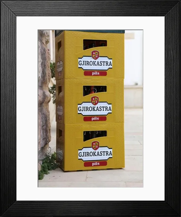 Framed Print : GJIROKASTER, ALBANIA - JULY 9, 2025: Gjirokastra Pils plastic beer crate in Gjirokaster town in Albania Framed Print : GJIROKASTER, ALBANIA - JULY 9, 2025: Gjirokastra Pils plastic beer crate in Gjirokaster town in Albania