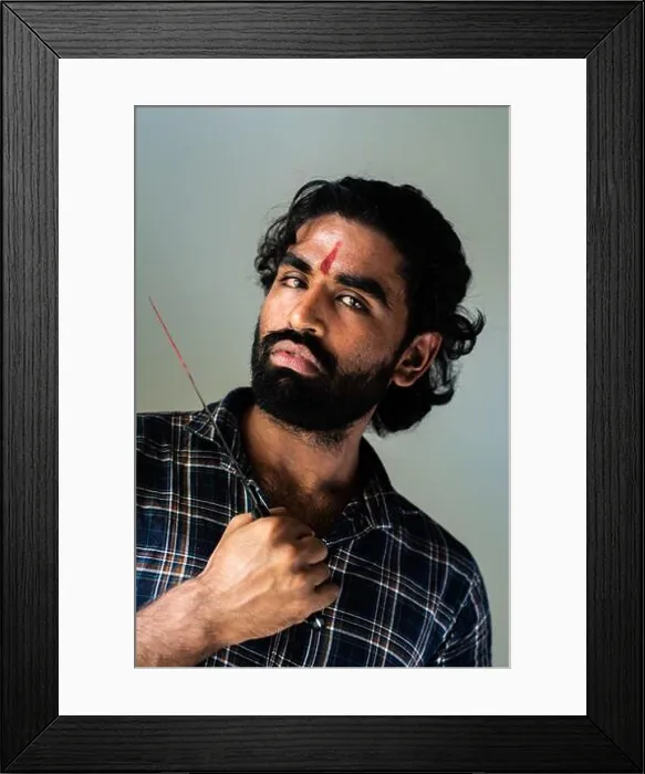Framed Print : indoor portrait of a bearded Indian male wearing a man bun Framed Print : indoor portrait of a bearded Indian male wearing a man bun