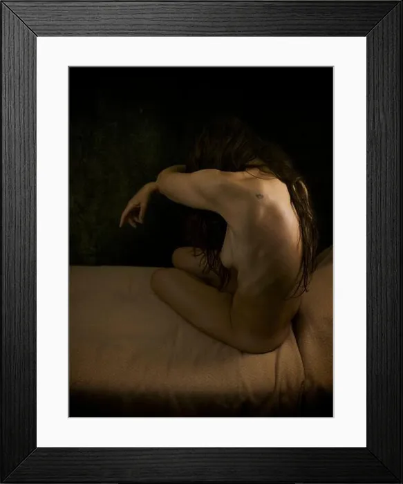 Framed Print : woman sitting on a couch without clothes covering her face with her long hair, spain Framed Print : woman sitting on a couch without clothes covering her face with her long hair, spain