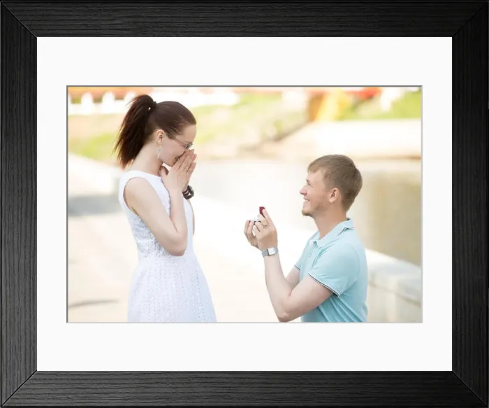 Framed Print : Handsome young man requesting hand of beloved pretty girlfriend Framed Print : Handsome young man requesting hand of beloved pretty girlfriend