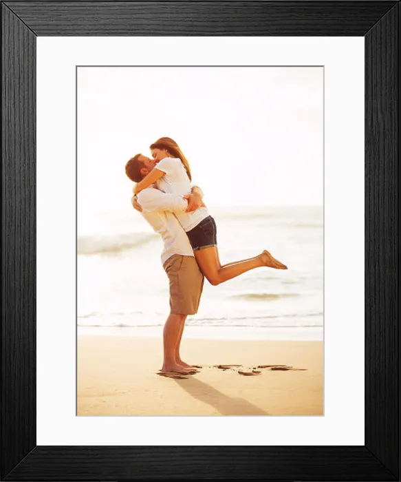 Framed Print : Happy Romantic Couple Kissing on the Beach at Sunset Framed Print : Happy Romantic Couple Kissing on the Beach at Sunset