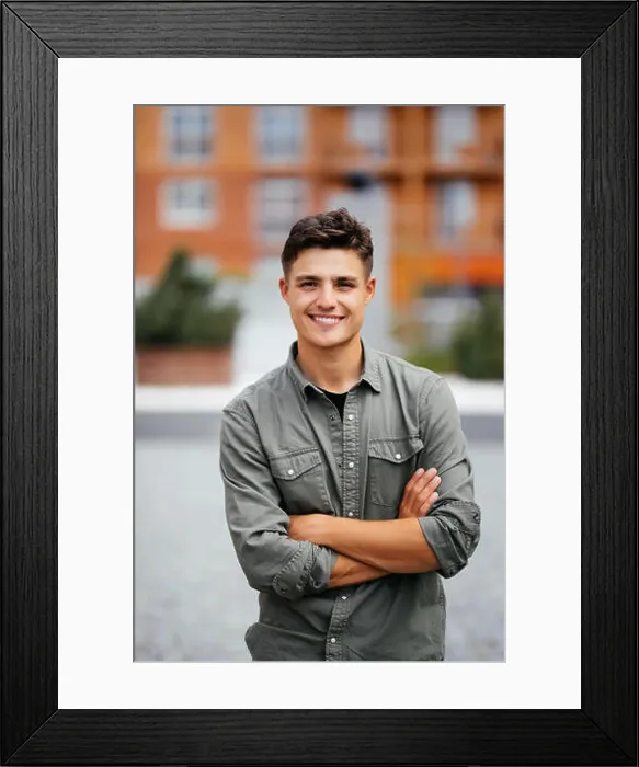 Framed Print : Outdoor portrait of handsome young man walking on the street, looking at camera Framed Print : Outdoor portrait of handsome young man walking on the street, looking at camera
