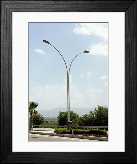 Framed Print : Highway lamp isolated on a blue sky background on the highway road Framed Print : Highway lamp isolated on a blue sky background on the highway road