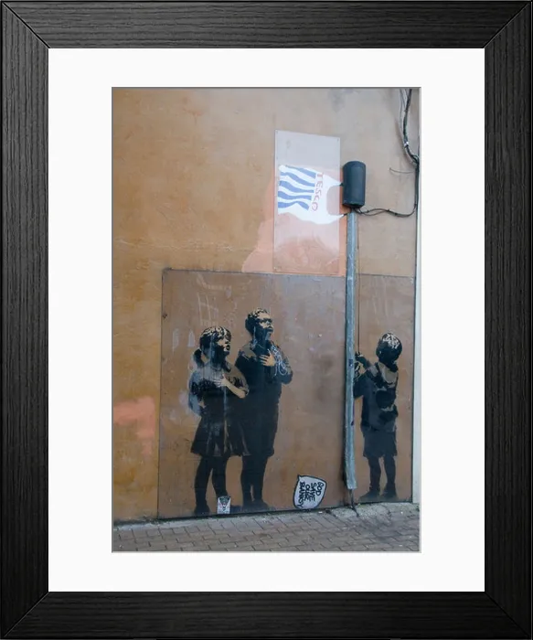 Framed Print : Banksy graffitti of raising Tesco bag protected by plastic Essex Road Islington London Framed Print : Banksy graffitti of raising Tesco bag protected by plastic Essex Road Islington London