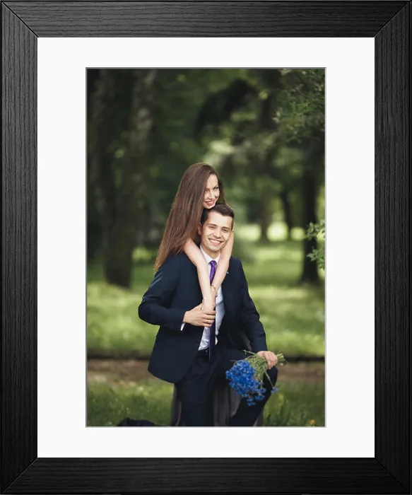 Framed Print : Loving Couple. Boy and girl walking in the beautiful park Framed Print : Loving Couple. Boy and girl walking in the beautiful park