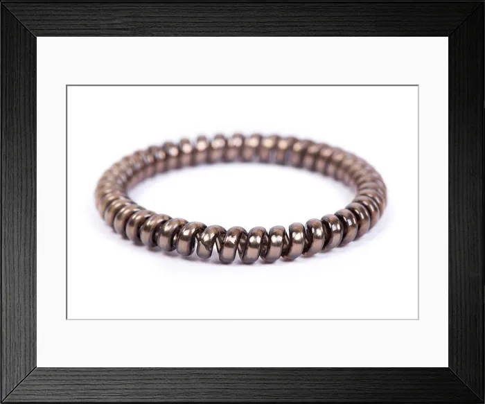 Framed Print : One brown spiral elastic for hair isolated on white background Framed Print : One brown spiral elastic for hair isolated on white background