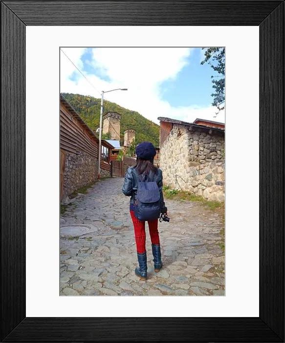 Framed Print : Female Traveler Climbing up to the Hill Leading to Medieval Svan Tower-house, Mestia Town, Svaneti Region of Georgia Framed Print : Female Traveler Climbing up to the Hill Leading to Medieval Svan Tower-house, Mestia Town, Svaneti Region of Georgia