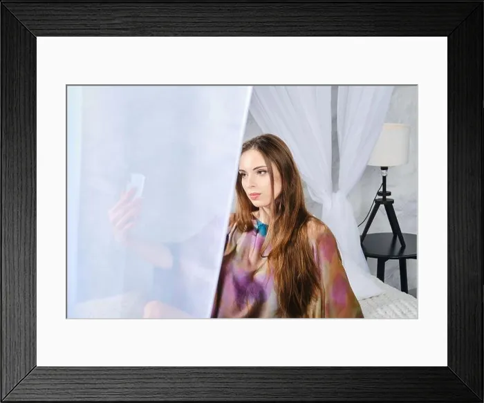 Framed Print : How to spend time at home? Cute woman makes self video for social media in bedroom Framed Print : How to spend time at home? Cute woman makes self video for social media in bedroom